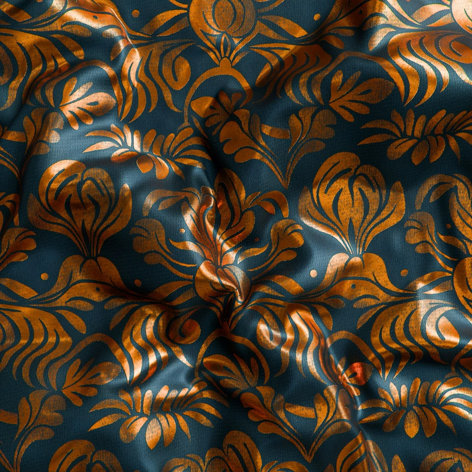 a close up of a blue and gold fabric